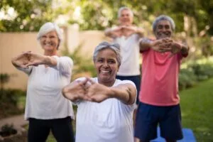 Group of seniors in fitness class outdoors | Working with your healthcare team