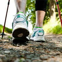 Woman walking along a trail | Alberta Health and Wellness Resources