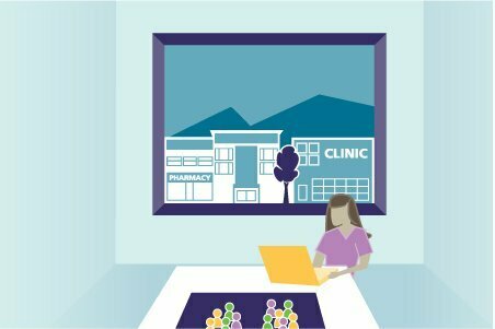 Woman sitting in front of woman on a laptop computer | Health Quality Council of Alberta